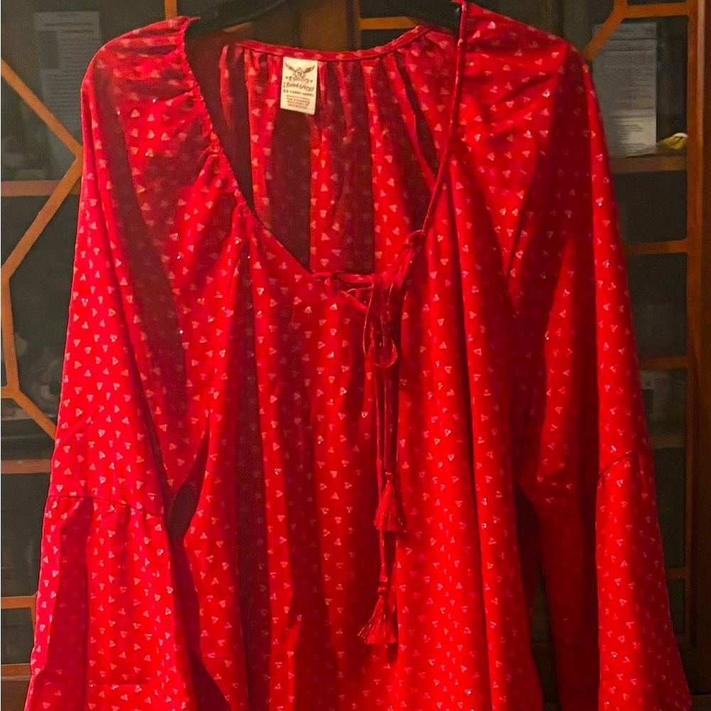 Red blouse with a touch of silver sparkles.